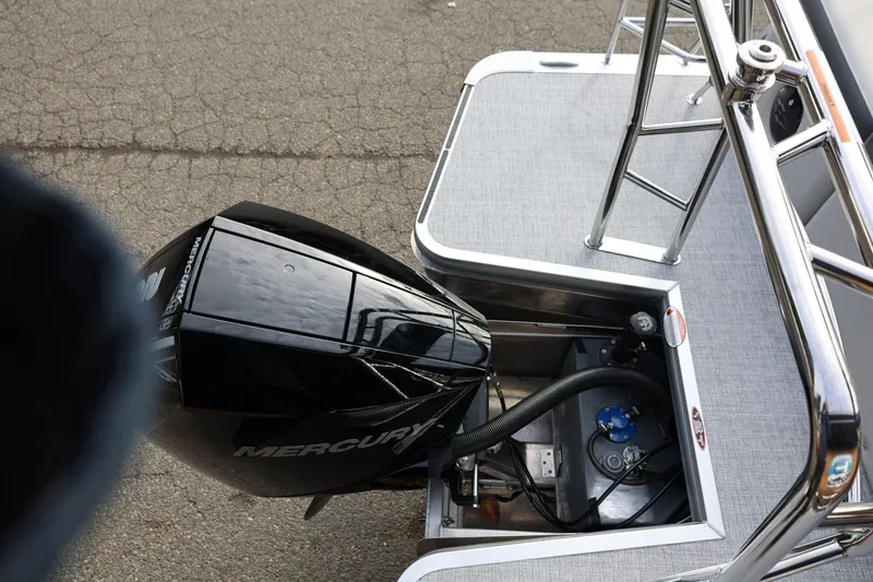 Slide: The Image of 2026 Harris CRUISER 230 SL boat with Mercury outboard motor, rear deck view. - 17