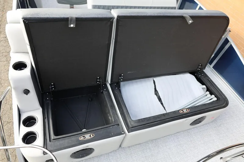 Slide: The Image of 2026 Harris CRUISER 230 SL boat storage compartments with cup holders and seating. - 22