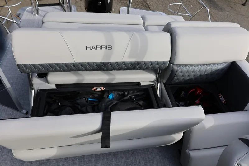 Slide: The Image of 2026 Harris CRUISER 230 SL boat interior with open storage compartments. - 23