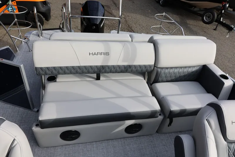Slide: The Image of 2026 Harris CRUISER 230 SL boat interior with plush seating and modern design. - 24