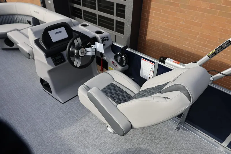 Slide: The Image of 2026 Harris CRUISER 230 SL boat interior with modern helm and seating. - 25