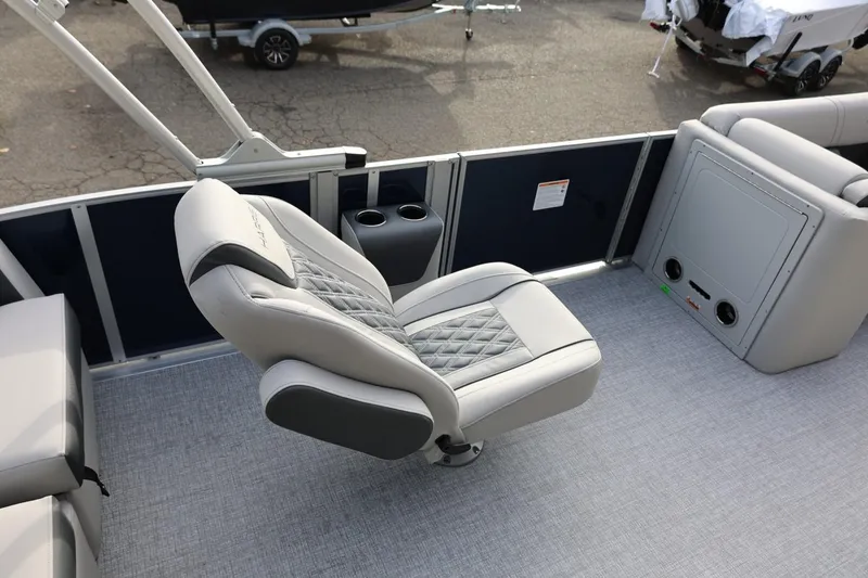 Slide: The Image of 2026 Harris CRUISER 230 SL boat interior with luxurious seating and cup holders. - 26