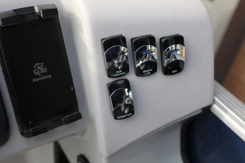 Slide: The Image of Control panel of 2026 Harris CRUISER 230 SL with switches for lighting and accessories. - 29
