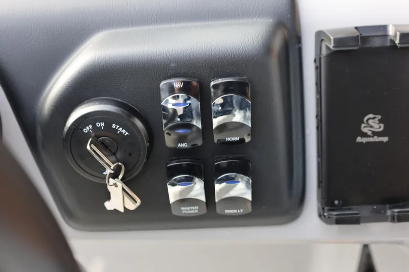 Slide: The Image of Control panel of 2026 Harris CRUISER 230 SL boat with ignition and switches. - 30