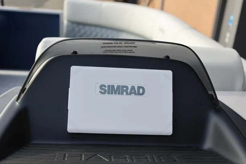Slide: The Image of Simrad navigation system on 2026 Harris Cruiser 230 SL boat dashboard. - 31
