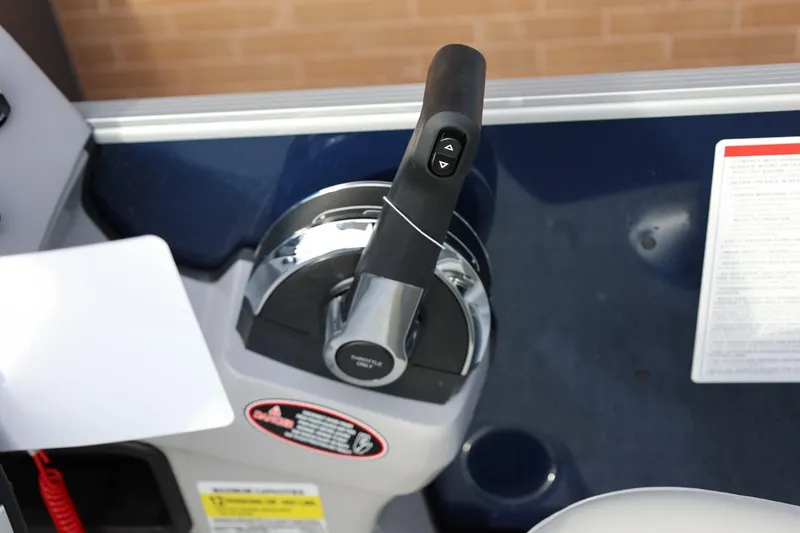Slide: The Image of Throttle control of 2026 Harris CRUISER 230 SL boat, featuring ergonomic design and control buttons. - 32