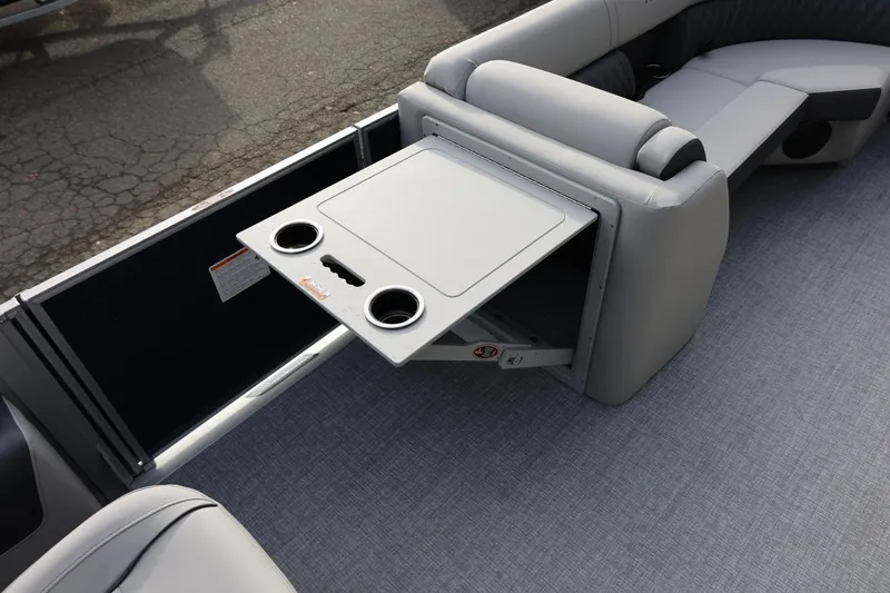 Slide: The Image of 2026 Harris CRUISER 230 SL boat interior with foldable table and cup holders. - 34