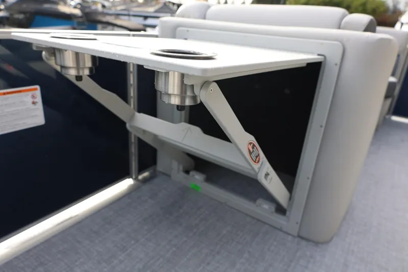 Slide: The Image of 2026 Harris CRUISER 230 SL boat interior with foldable table and cup holders. - 35