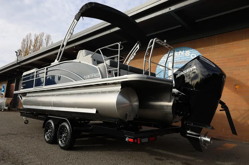 Slide: The Image of 2026 Harris CRUISER 230 SL pontoon boat with Mercury engine on trailer. - 4