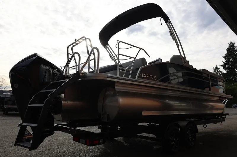 Slide: The Image of 2026 Harris CRUISER 230 SL pontoon boat with sleek design and modern features. - 8