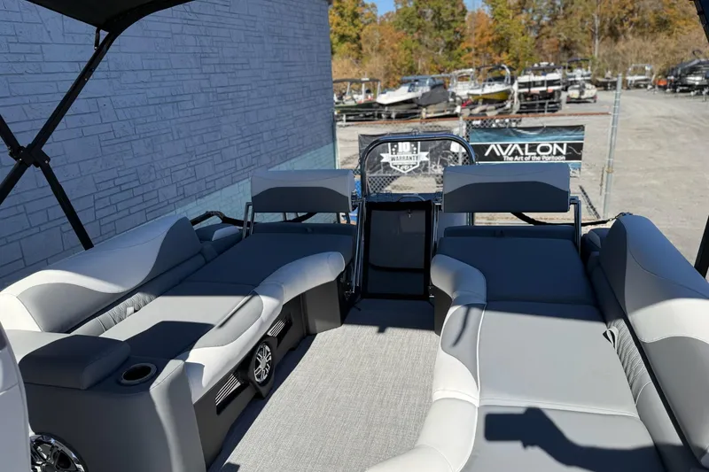 Slide: The Image of 2026 Avalon 2385 LSZ QLS pontoon boat interior with gray seating and outdoor view. - 3