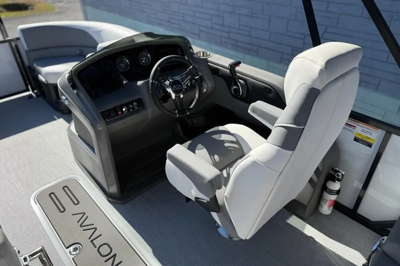 Slide: The Image of 2026 Avalon 2385 LSZ QLS boat interior with steering console and seating. - 8