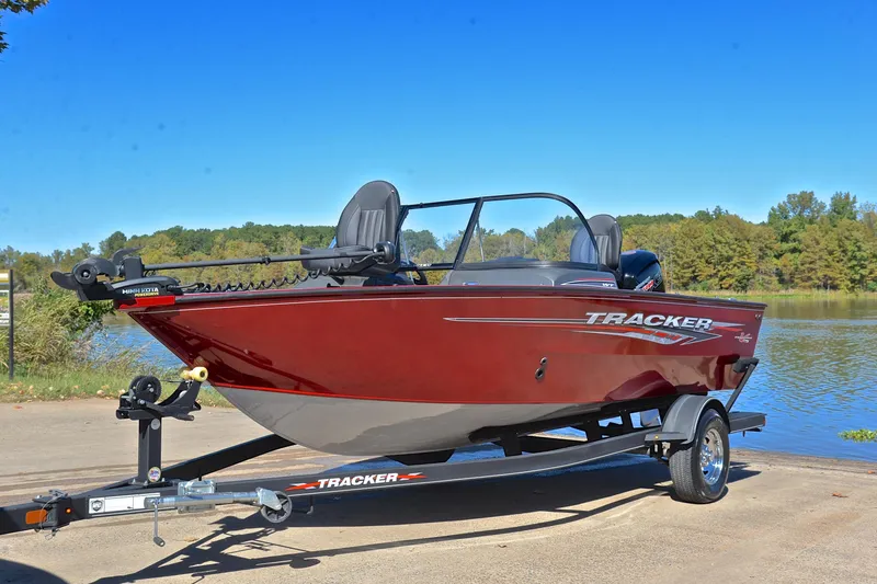 Slide: The Image of 2022 Bass Tracker Pro Guide V175 WT boat on trailer by a lake. - 10