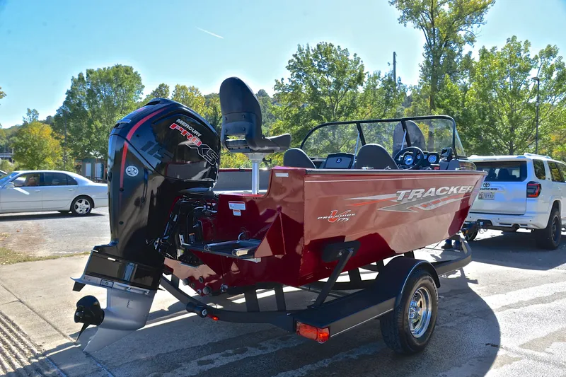 Slide: The Image of 2022 Bass Tracker Pro Guide V175 WT boat on trailer, parked outdoors. - 14
