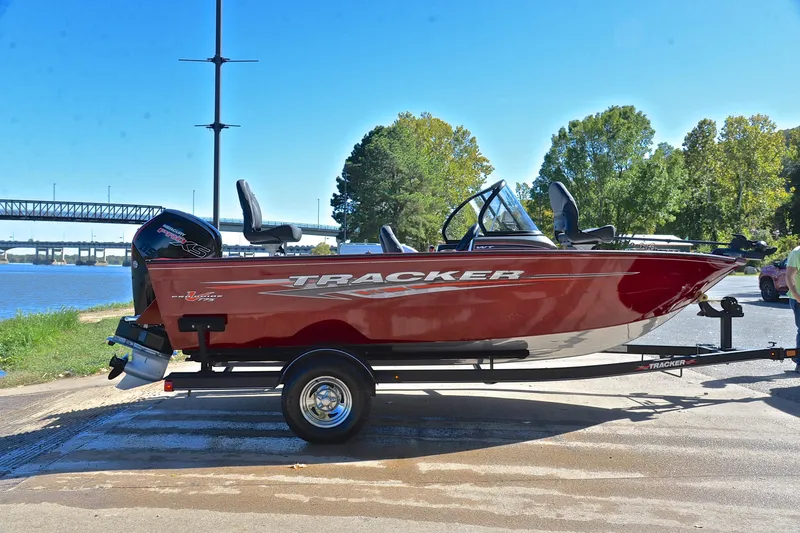 Slide: The Image of 2022 Bass Tracker Pro Guide V175 WT boat on trailer by riverside. - 15