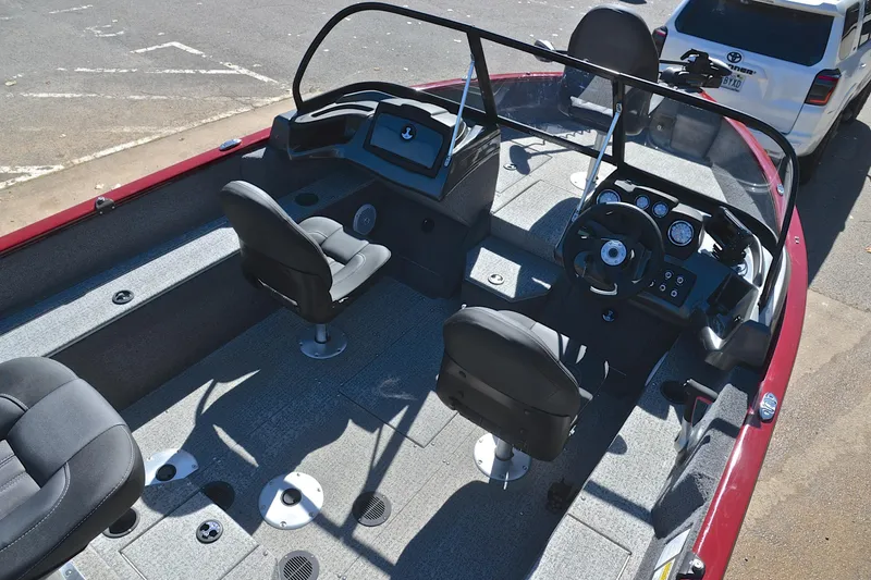 Slide: The Image of 2022 Bass Tracker Pro Guide V175 WT boat interior with seating and steering console. - 19
