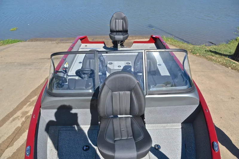 Slide: The Image of 2022 Bass Tracker Pro Guide V175 WT boat at a lakeside launch ramp. - 20