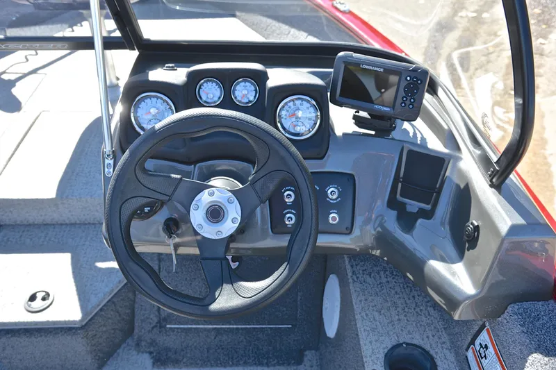 Slide: The Image of 2022 Bass Tracker Pro Guide V175 WT dashboard with steering wheel and navigation system. - 24