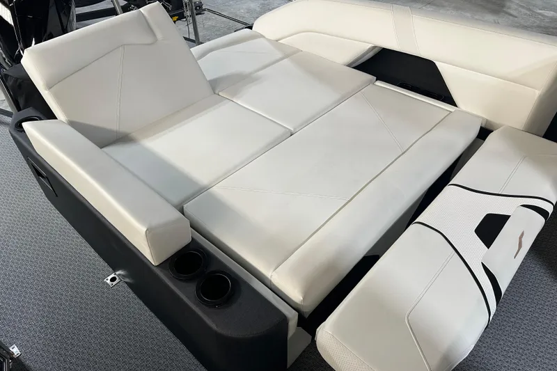 Slide: The Image of 2026 Evotti 723 CS boat interior with white cushioned seating and cup holders. - 10