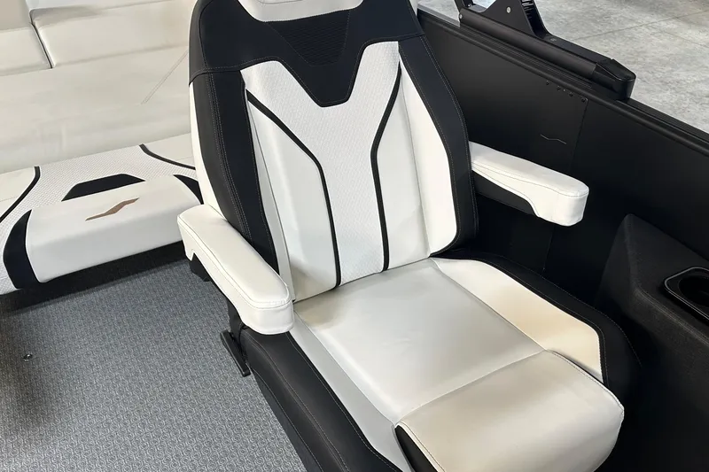 Slide: The Image of Luxury seating in 2026 Evotti 723 CS boat, featuring sleek black and white design. - 12