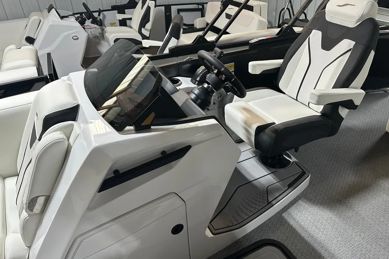 Slide: The Image of 2026 Evotti 723 CS boat interior with modern steering and seating design. - 13