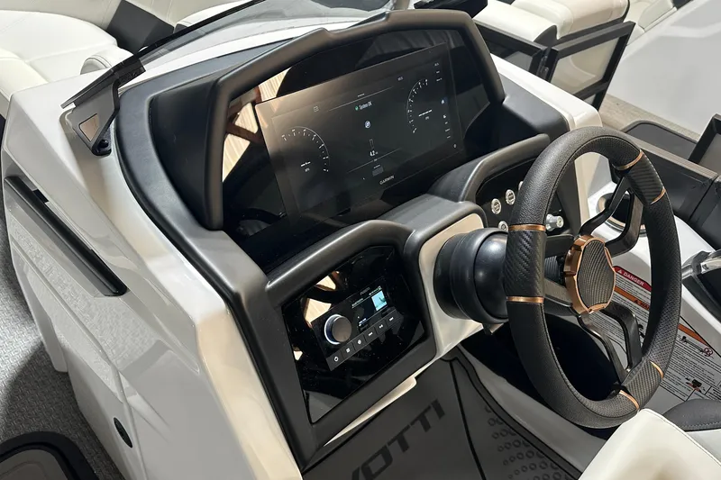 Slide: The Image of 2026 Evotti 723 CS boat dashboard with modern steering wheel and digital display. - 14