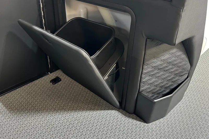 Slide: The Image of Evotti 723 CS 2026 interior storage compartment with textured design and open bin. - 18