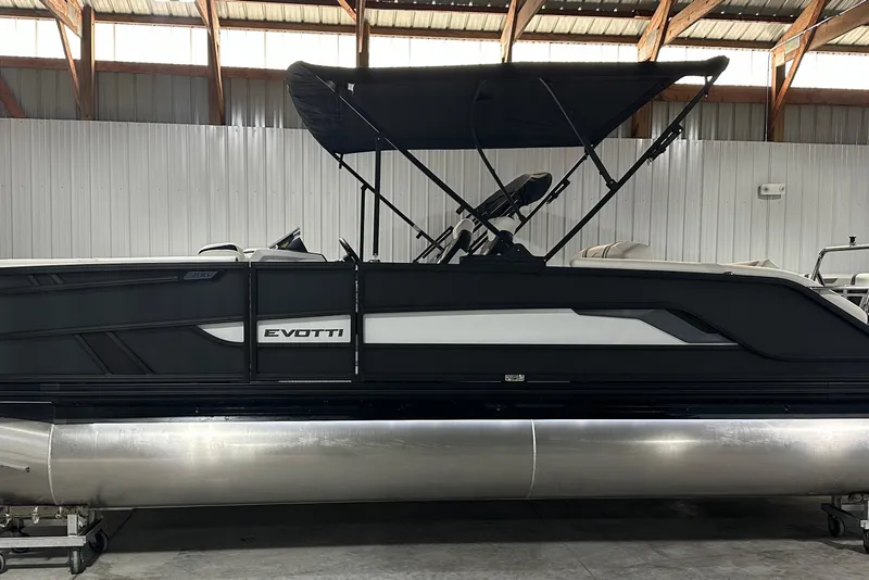 Slide: The Image of 2026 Evotti 723 CS pontoon boat with canopy in a warehouse setting. - 19