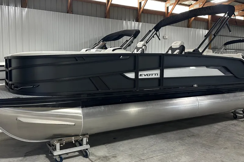 Slide: The Image of 2026 Evotti 723 CS pontoon boat in a warehouse setting. - 2