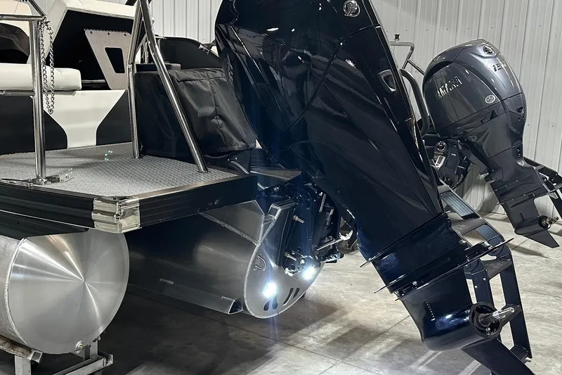 Slide: The Image of 2026 Evotti 723 CS boat with dual outboard motors in a garage setting. - 21