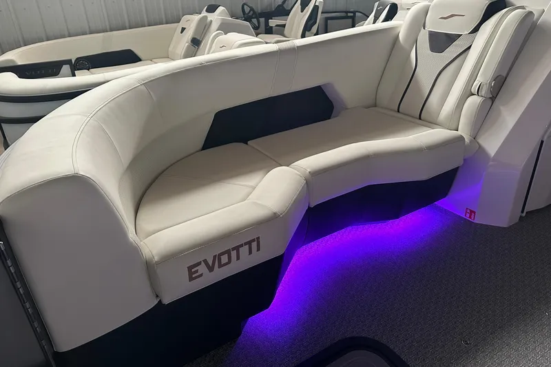 Slide: The Image of Luxurious Evotti 723 CS boat interior with white seating and purple LED lighting, 2026 model. - 25