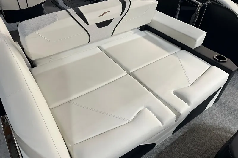 Slide: The Image of Luxurious white seating on 2026 Evotti 723 CS boat, featuring sleek design and cup holder. - 7
