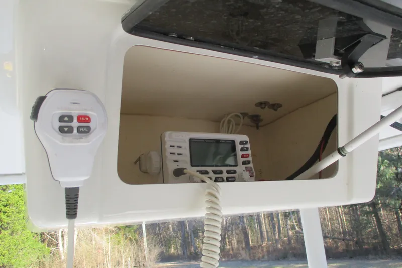 Slide: The Image of 2023 Robalo R302 Center Console boat communication system with radio and microphone. - 13