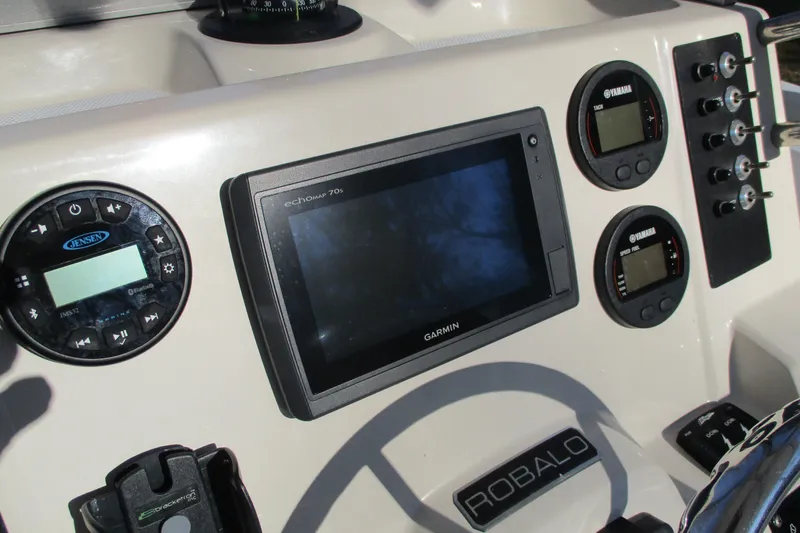 Slide: The Image of 2023 Robalo R302 Center Console dashboard with Garmin and Yamaha displays. - 14