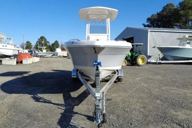 Slide: The Image of 2023 Robalo R302 Center Console boat on trailer in outdoor storage area. - 9