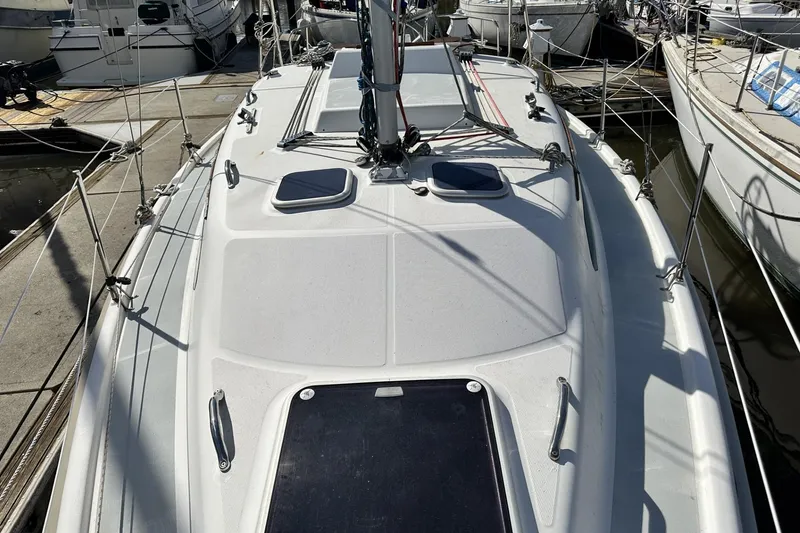 Slide: The Image of Hunter 290 sailboat deck, 2000 model, docked in a marina. - 2