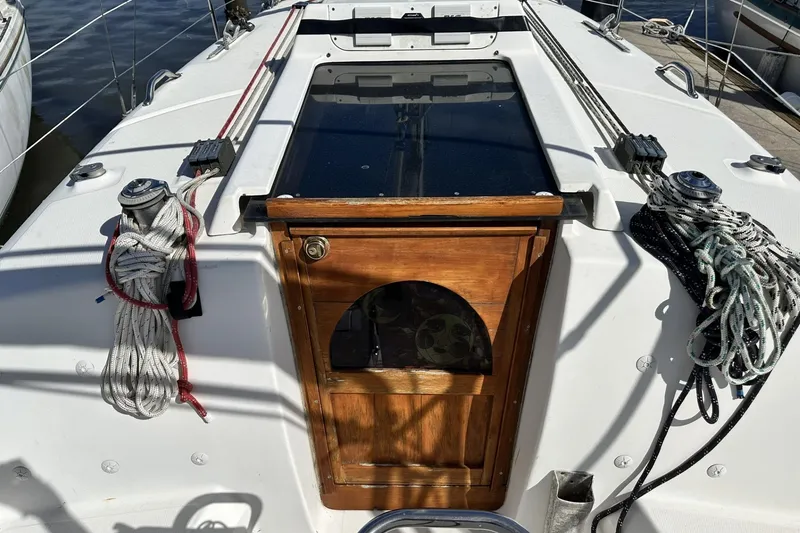 Slide: The Image of Hunter 290 sailboat cockpit with ropes and wooden hatch, 2000 model. - 6
