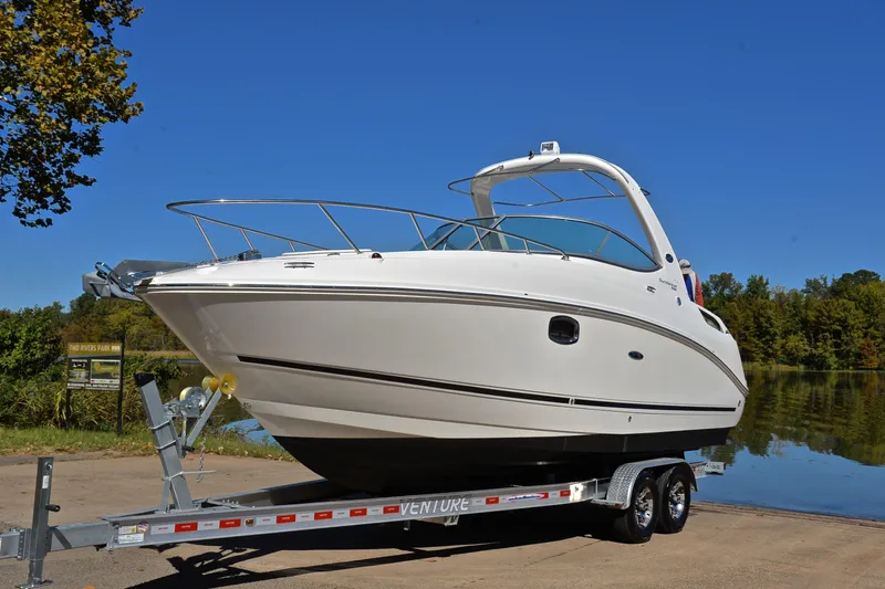 Slide: The Image of 2011 Sea Ray 260 Sundancer boat on trailer at Two Rivers Park. - 11