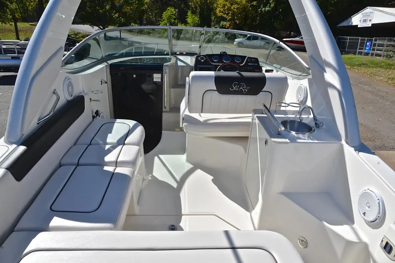 Slide: The Image of Interior view of 2011 Sea Ray 260 Sundancer boat with seating and helm. - 19