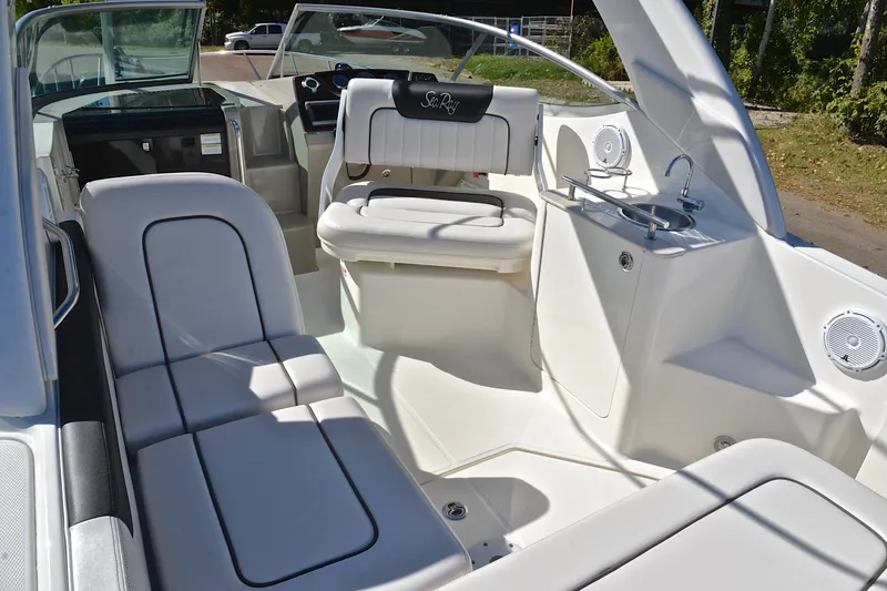 Slide: The Image of Interior of 2011 Sea Ray 260 Sundancer boat with seating and sink. - 29