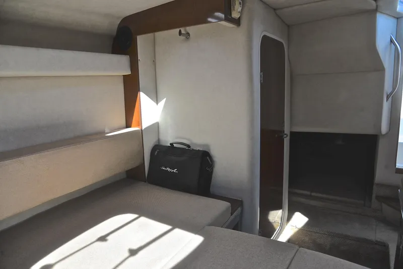 Slide: The Image of Interior cabin of 2011 Sea Ray 260 Sundancer boat, featuring seating and storage. - 32