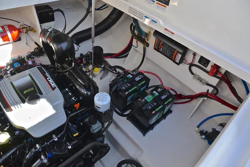 Slide: The Image of Engine compartment of 2011 Sea Ray 260 Sundancer with batteries and wiring. - 38