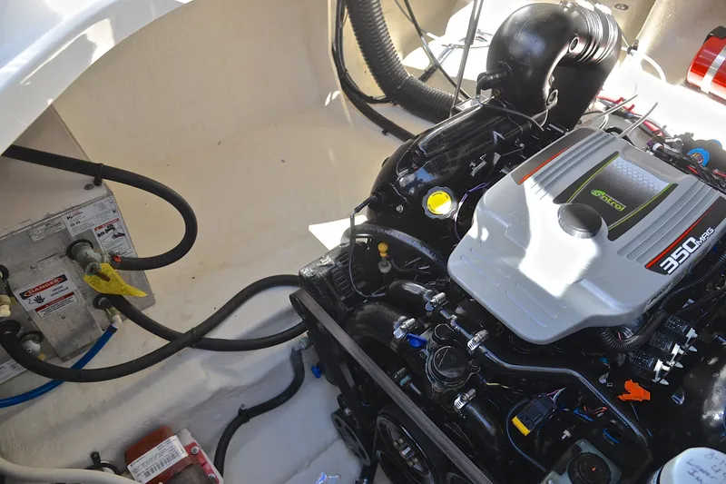 Slide: The Image of Engine compartment of a 2011 Sea Ray 260 Sundancer boat, featuring a 350 MAG engine. - 39