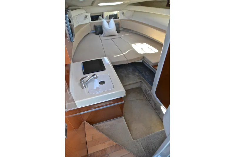 Slide: The Image of Interior of 2011 Sea Ray 260 Sundancer with cozy seating and compact sink area. - 40