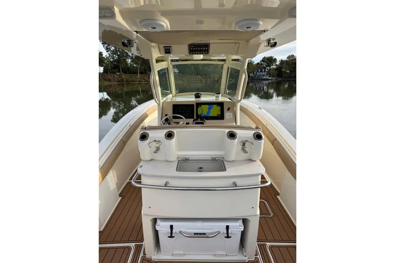 Slide: The Image of Twin Yamaha 300 engines on a 2016 Scout 300 LXF boat, viewed from the stern. - 24