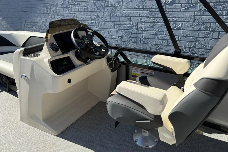 Slide: The Image of 2026 Avalon Venture 85 VRB 2385 boat interior with steering console and captain's chair. - 12