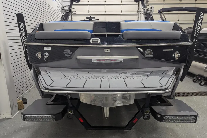 Slide: The Image of 2022 Malibu Wakesetter 22 LSV boat rear view in showroom setting. - 20