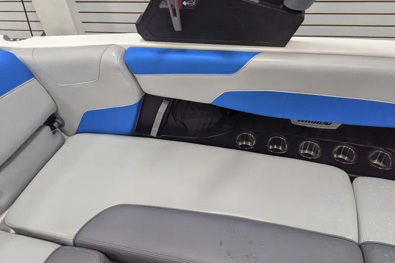 Slide: The Image of 2022 Malibu Wakesetter 22 LSV interior with blue and gray seating and cup holders. - 24