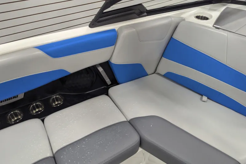 Slide: The Image of 2022 Malibu Wakesetter 22 LSV interior with blue and gray seating. - 25