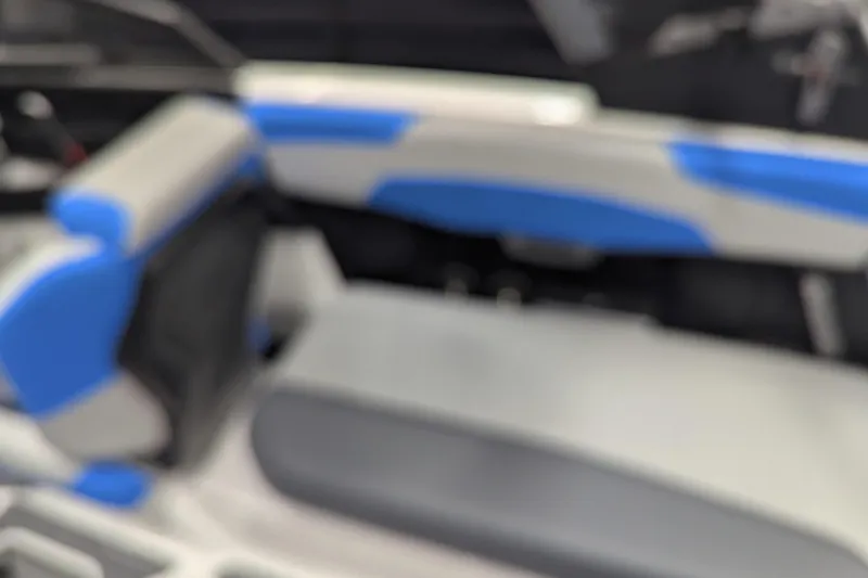 Slide: The Image of Blurry interior of 2022 Malibu Wakesetter 22 LSV boat with blue and gray seating. - 29